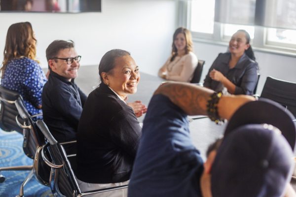 Successful Maori Pacific Islander business woman leading a team of start up entrepreneurs in a corporate business meeting in New Zealand